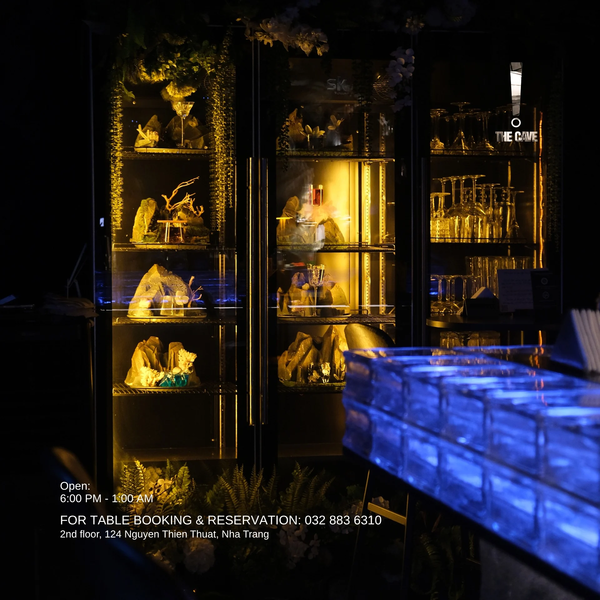 Blue glass blocks and illuminated mineral details at the bar